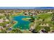 Aerial view of community with lake, golf course, and homes at 3199 N 159Th Dr, Goodyear, AZ 85395