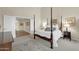 Elegant bedroom with a four-poster bed and ample natural light at 3199 N 159Th Dr, Goodyear, AZ 85395