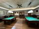 Recreation room with two billiard tables and a bar area at 3199 N 159Th Dr, Goodyear, AZ 85395