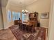 Formal dining room featuring a wood table, chandelier, and area rug at 3199 N 159Th Dr, Goodyear, AZ 85395