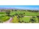 Expansive golf course with palm trees and mountain views at 3199 N 159Th Dr, Goodyear, AZ 85395