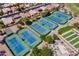 Aerial view of community tennis courts and surrounding landscape at 3199 N 159Th Dr, Goodyear, AZ 85395