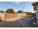 Backyard with concrete patio and wooden gate at 3440 W Krall St, Phoenix, AZ 85017