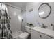 Updated bathroom with gray tile, white vanity, and modern fixtures at 3440 W Krall St, Phoenix, AZ 85017