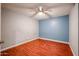 Bright bedroom with wood floors and ceiling fan at 3440 W Krall St, Phoenix, AZ 85017