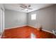 Simple bedroom with wood floors and a ceiling fan at 3440 W Krall St, Phoenix, AZ 85017