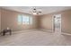 Bright bedroom with ceiling fan and wood-look floors at 39979 W Robbins Dr, Maricopa, AZ 85138