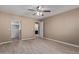 Bedroom with ceiling fan, wood-look floors, and closet at 39979 W Robbins Dr, Maricopa, AZ 85138