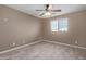 Bright bedroom with ceiling fan, wood-look floors, and window blinds at 39979 W Robbins Dr, Maricopa, AZ 85138