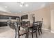 Kitchen with dark cabinets, granite counters, and an island at 39979 W Robbins Dr, Maricopa, AZ 85138