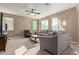 Living room with gray sofas and ceiling fan at 39979 W Robbins Dr, Maricopa, AZ 85138