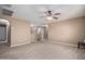 Open living area with ceiling fan and wood-like floors at 39979 W Robbins Dr, Maricopa, AZ 85138