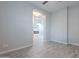 Bright bedroom with wood-look floors and view into living room at 4137 E Ronald St, Gilbert, AZ 85295