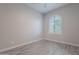 Spacious bedroom with wood-look floors and an arched window at 4137 E Ronald St, Gilbert, AZ 85295