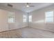 Spacious bedroom featuring wood-look tile floors and ceiling fan at 4137 E Ronald St, Gilbert, AZ 85295