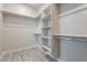 Large walk-in closet with shelves and hanging rods at 4137 E Ronald St, Gilbert, AZ 85295