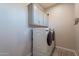 Bright laundry room, featuring modern washer and dryer, and ample storage at 4137 E Ronald St, Gilbert, AZ 85295