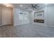 Bright living room features a fireplace and wood-look tile floors at 4137 E Ronald St, Gilbert, AZ 85295