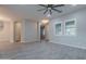 Spacious living room with wood-look floors and ceiling fan at 4137 E Ronald St, Gilbert, AZ 85295