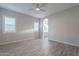 Main bedroom with wood-look floors and ensuite bathroom access at 4137 E Ronald St, Gilbert, AZ 85295