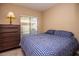 Spacious bedroom with a dresser and queen-size bed at 4407 E Villa Theresa Dr, Phoenix, AZ 85032