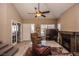 Living area with vaulted ceiling, fireplace, and patio access at 4407 E Villa Theresa Dr, Phoenix, AZ 85032