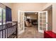 View through French doors shows a living room with fireplace and seating at 4407 E Villa Theresa Dr, Phoenix, AZ 85032