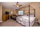 Large main bedroom with a canopy bed and sitting area at 4407 E Villa Theresa Dr, Phoenix, AZ 85032