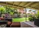 Relaxing covered patio overlooks a grassy backyard at 4407 E Villa Theresa Dr, Phoenix, AZ 85032