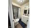 Bathroom with gray tile shower and white vanity at 4854 W Berkeley Rd, Phoenix, AZ 85035