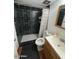 Clean bathroom with dark tile shower and white vanity at 4854 W Berkeley Rd, Phoenix, AZ 85035