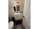 Clean bathroom with vanity and updated flooring at 4854 W Berkeley Rd, Phoenix, AZ 85035