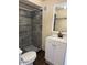 Updated bathroom with a tiled shower and modern vanity at 4854 W Berkeley Rd, Phoenix, AZ 85035