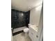 Bathroom showcasing a walk-in shower with decorative tile, modern vanity, and updated fixtures at 4854 W Berkeley Rd, Phoenix, AZ 85035