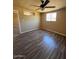 Cozy bedroom features wood floors and a ceiling fan at 4854 W Berkeley Rd, Phoenix, AZ 85035
