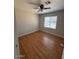 Bedroom featuring wood floors, neutral paint, and a large window at 4854 W Berkeley Rd, Phoenix, AZ 85035