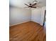 Bedroom featuring wood floors, neutral paint, a ceiling fan, and a closet at 4854 W Berkeley Rd, Phoenix, AZ 85035