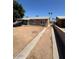 Exterior of a single story home with a dirt front yard, sidewalk, and a peek at the carport at 4854 W Berkeley Rd, Phoenix, AZ 85035