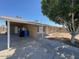 Spacious single story home with a carport, front yard featuring a large tree at 4854 W Berkeley Rd, Phoenix, AZ 85035