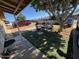 Front yard with seating area and trees at 4854 W Berkeley Rd, Phoenix, AZ 85035