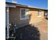 Tan house exterior with white framed windows at 4854 W Berkeley Rd, Phoenix, AZ 85035