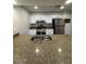 Modern kitchen featuring stainless appliances, granite countertops, and an undermount sink at 4854 W Berkeley Rd, Phoenix, AZ 85035