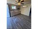 A compact kitchen space with modern cabinetry, appliances, and wood floors at 4854 W Berkeley Rd, Phoenix, AZ 85035