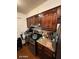 Kitchen with dark wood cabinets and granite countertops at 4854 W Berkeley Rd, Phoenix, AZ 85035