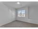 Spacious bedroom with window, closet and built-in shelving at 5429 W Kerry Ln, Glendale, AZ 85308