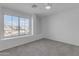 Well-lit bedroom featuring a large window with a view at 5429 W Kerry Ln, Glendale, AZ 85308