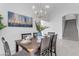 Elegant dining room with chandelier and large artwork at 5429 W Kerry Ln, Glendale, AZ 85308