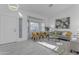 Spacious living room with gray sofa and yellow accent chairs at 5429 W Kerry Ln, Glendale, AZ 85308