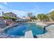 Refreshing blue pool with diving board, ready for summer fun at 5429 W Kerry Ln, Glendale, AZ 85308