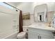 Clean bathroom with a shower/tub combo, white vanity, and modern fixtures at 5629 S Veneto --, Mesa, AZ 85212